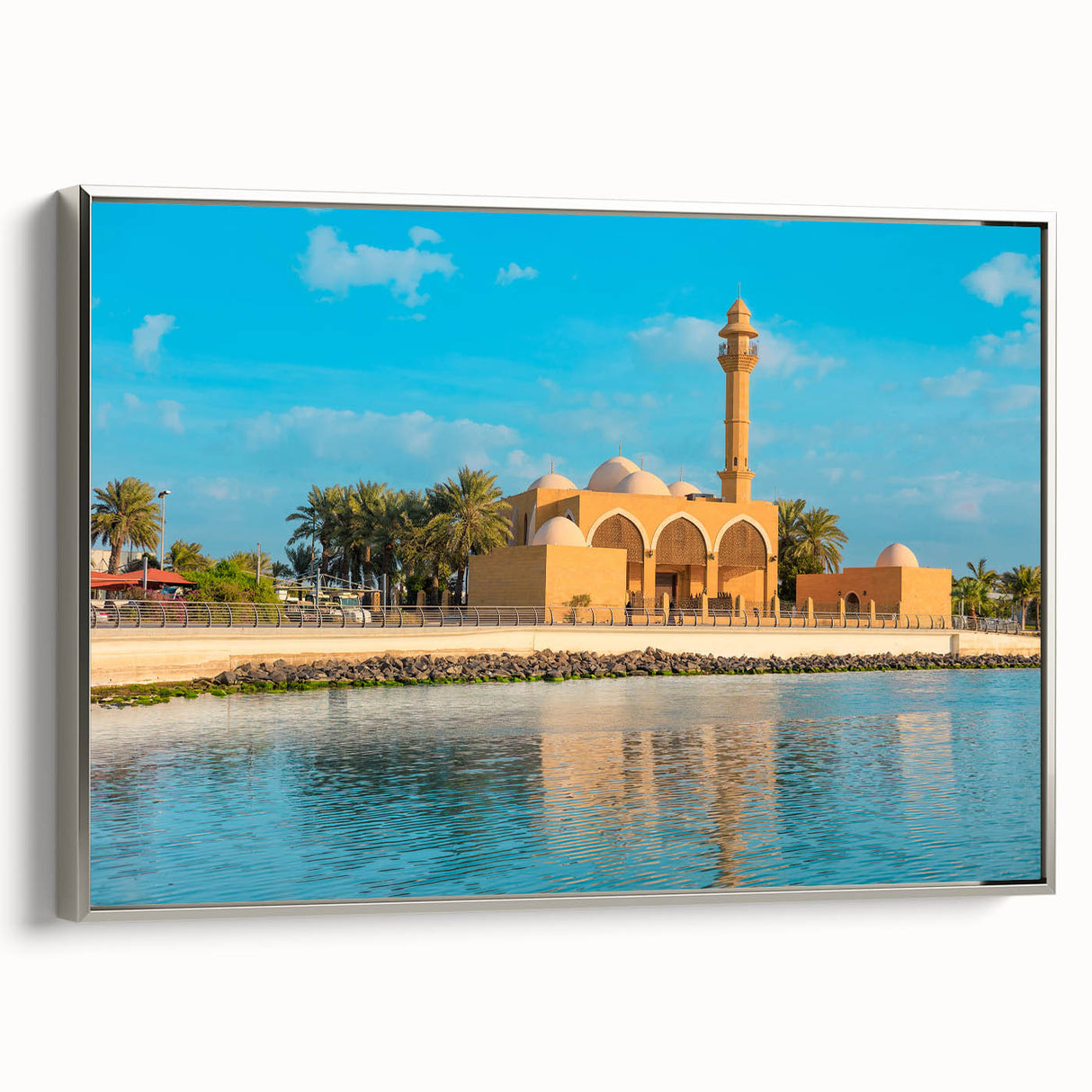 Framed canvas featuring a vintage-style landscape painting of a Middle Eastern desert scene in muted earth tones.