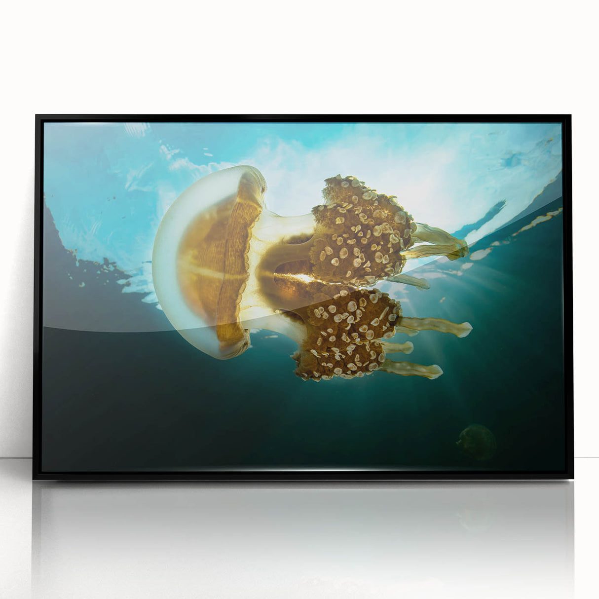 Large abstract wall art depicting oceanic views in vibrant blue tones on a framed acrylic.