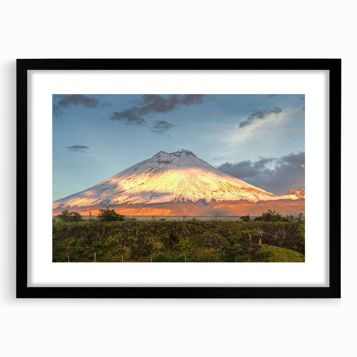 Colorful abstract art print of a South American scenery in a large black frame, ideal for living room decor.