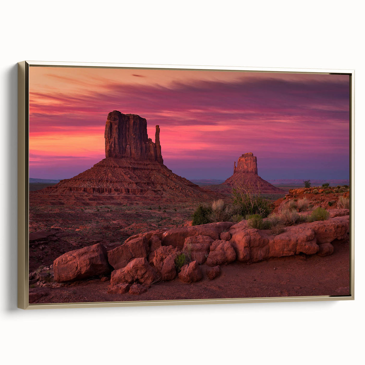Framed canvas depicting Monument Valley in muted gold and black tones, suitable for bedroom wall art.