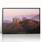 Large abstract wall art depicting Sedona's red rock formations in muted earth tones, framed in black acrylic.