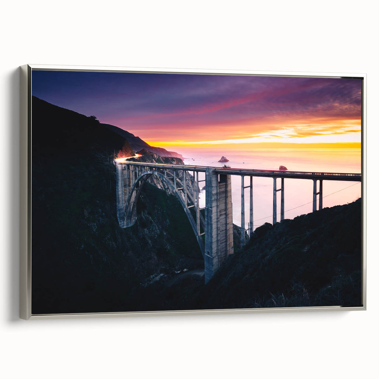 Framed canvas featuring a vintage-style landscape painting of Big Sur, California, with vibrant, colorful hues.