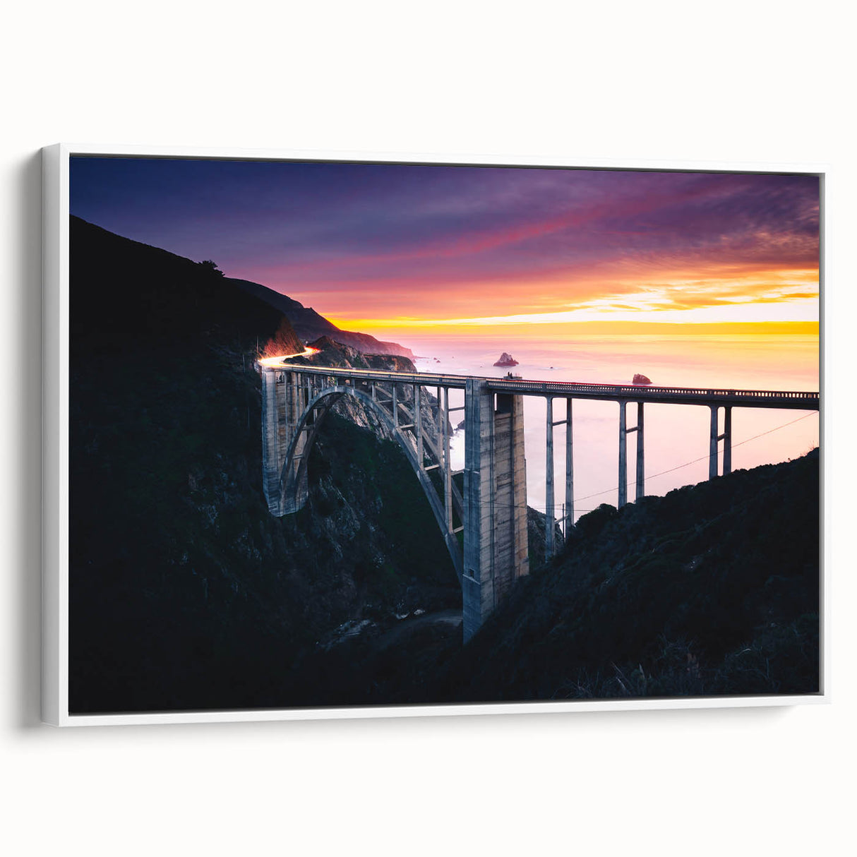 Vintage poster art of Big Sur in vibrant colors on a large framed canvas, ideal for living room decor.