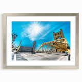 Textured abstract art print depicting a dynamic Sacramento scene in muted earth tones, framed in silver.