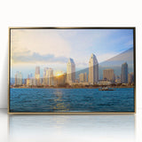 Acrylic print of San Diego skyline with gold frame, featuring soft pastel shades, ideal for nursery wall art.