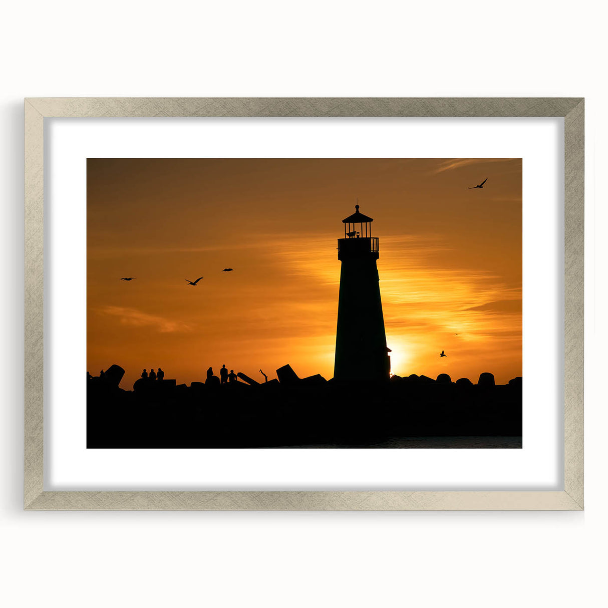 Textured abstract art print depicting the Santa Cruz coastline in muted blue and grey tones, framed in silver.