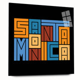Large abstract wall art of Santa Monica scenery in muted blue and green tones on acrylic glass.