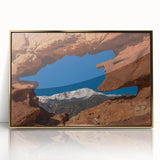 Large art print of Colorado Springs scenery in gold-framed acrylic, featuring mid-century modernist style.