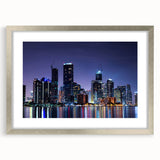 Textured art print of abstract Miami skyline in muted blue and gray tones on a framed silver mat.