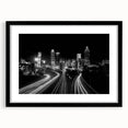 Abstract art print of Atlanta skyline in vibrant colors on a large framed canvas, suitable for living room decor.