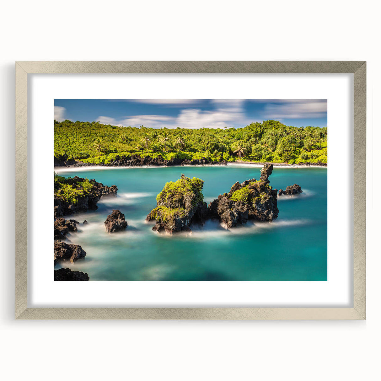 Textured abstract art print of a Maui landscape in muted earth tones on a framed silver mat, suitable for bedroom decor.