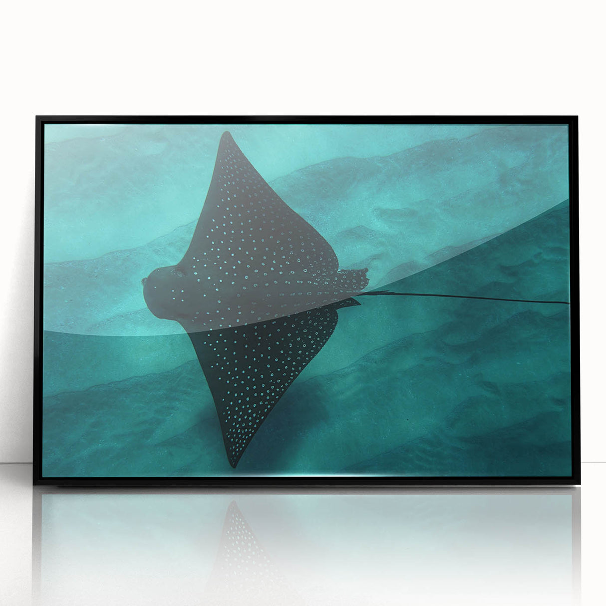 Large abstract wall art depicting Oahu's coastline in muted blue and green tones, framed in black acrylic.