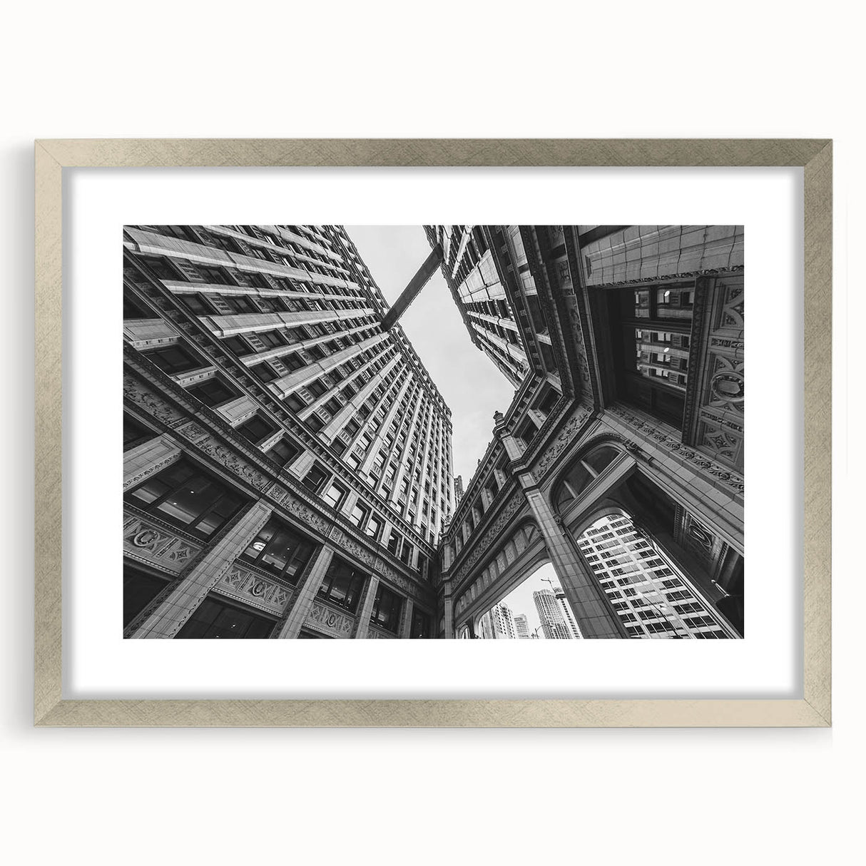 Textured art print of abstract Chicago skyline in muted silver and gray tones on a framed mat, ideal for bedroom decor.