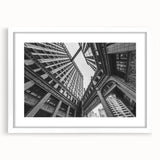Abstract art print of Chicago skyline in muted gray and blue tones on a framed white mat, ideal for dining room decor.