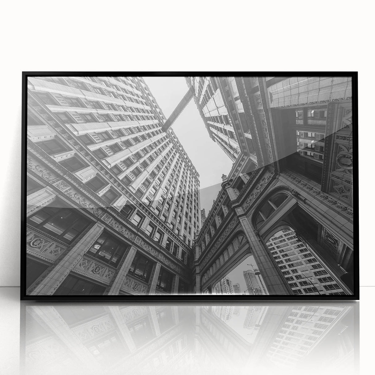 Large abstract wall art of Chicago skyline in muted gray and blue tones on a framed acrylic print.