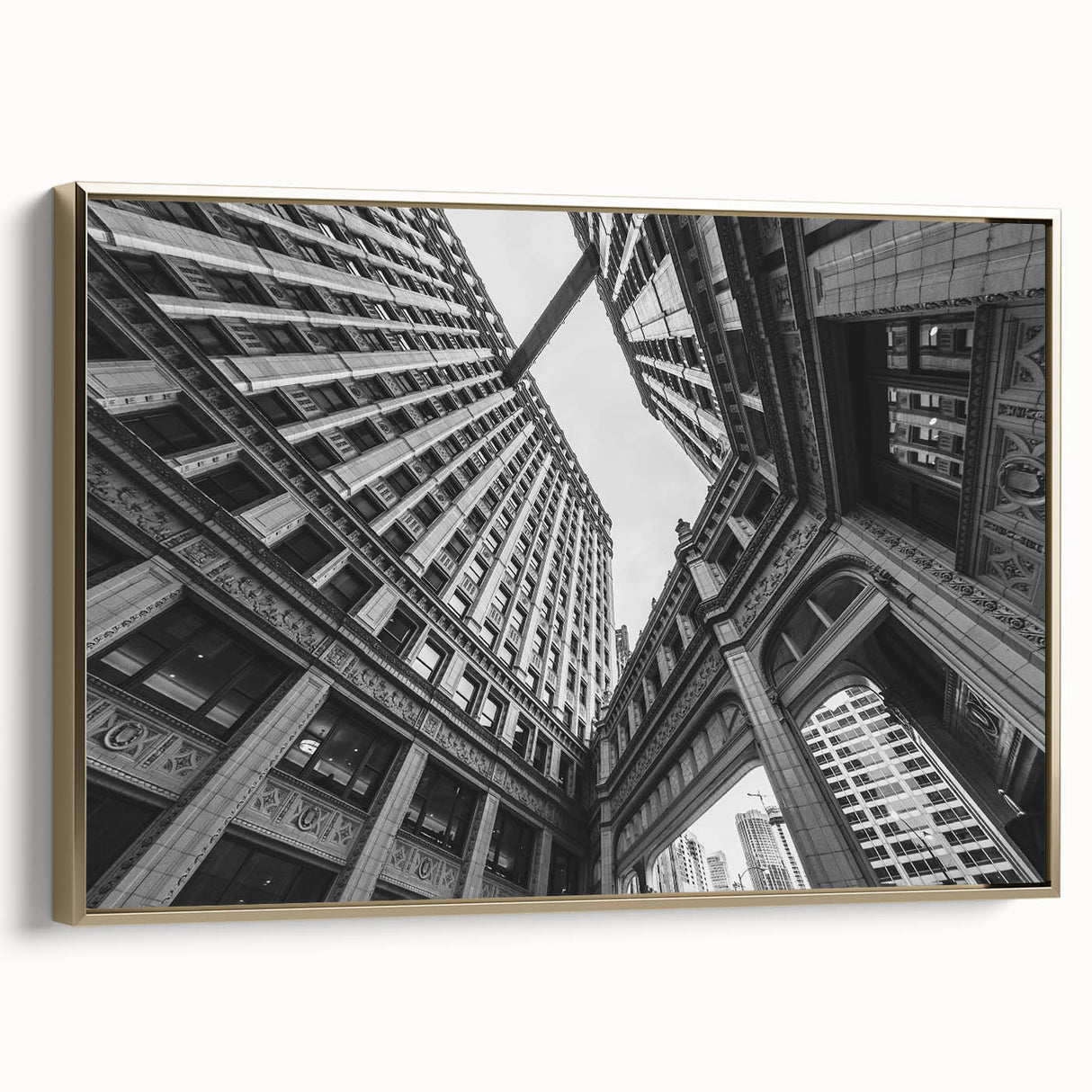 Framed canvas depicting a vintage-style Chicago skyline in black and gold tones, ideal for bedroom wall art.