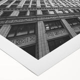 Art deco poster of Chicago skyline in monochrome shades on rolled canvas, suitable for dining room wall.