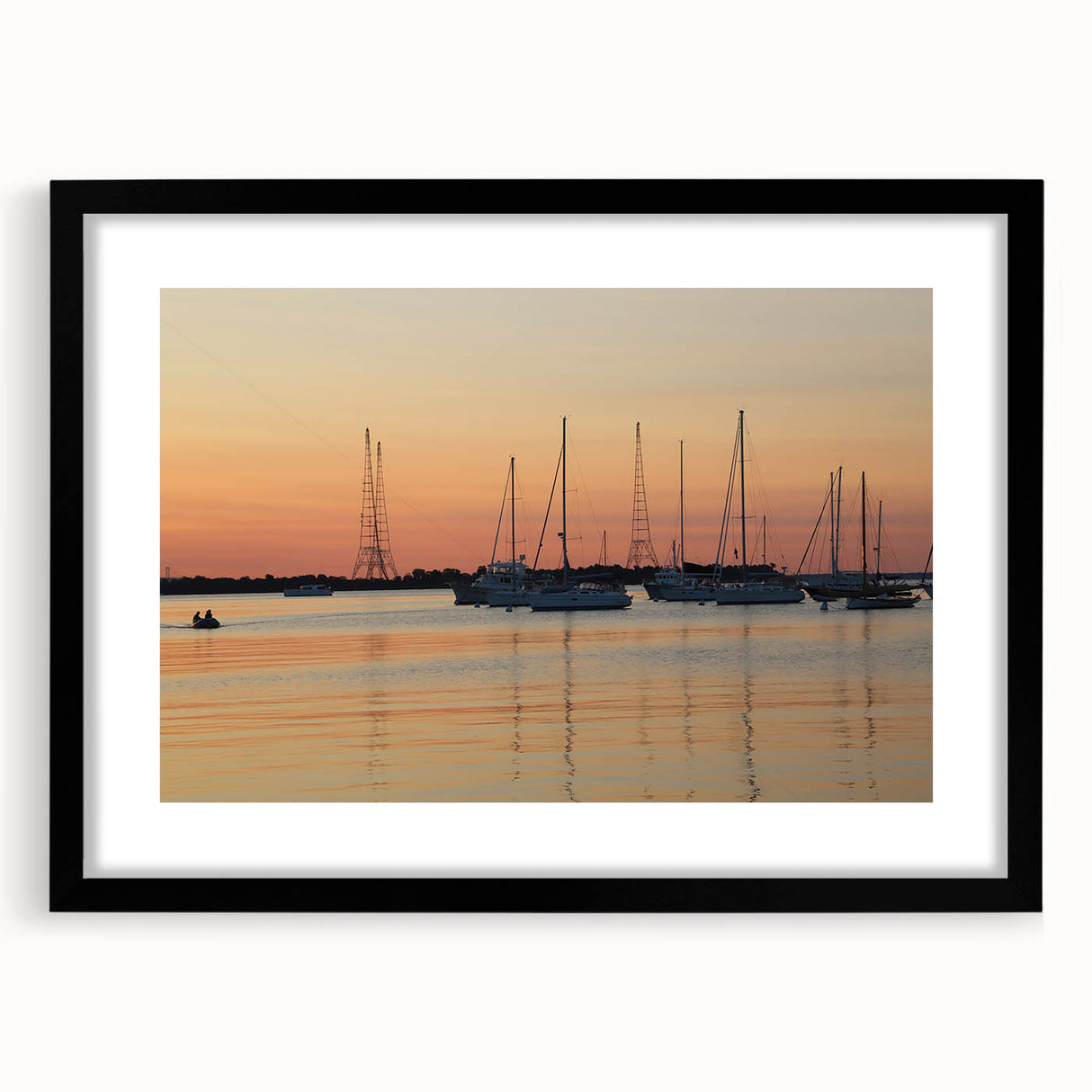 Abstract art print of Annapolis skyline in vibrant colors on a large, textured canvas, framed in black.