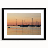 Abstract art print of Annapolis skyline in vibrant colors on a large, textured canvas, framed in black.