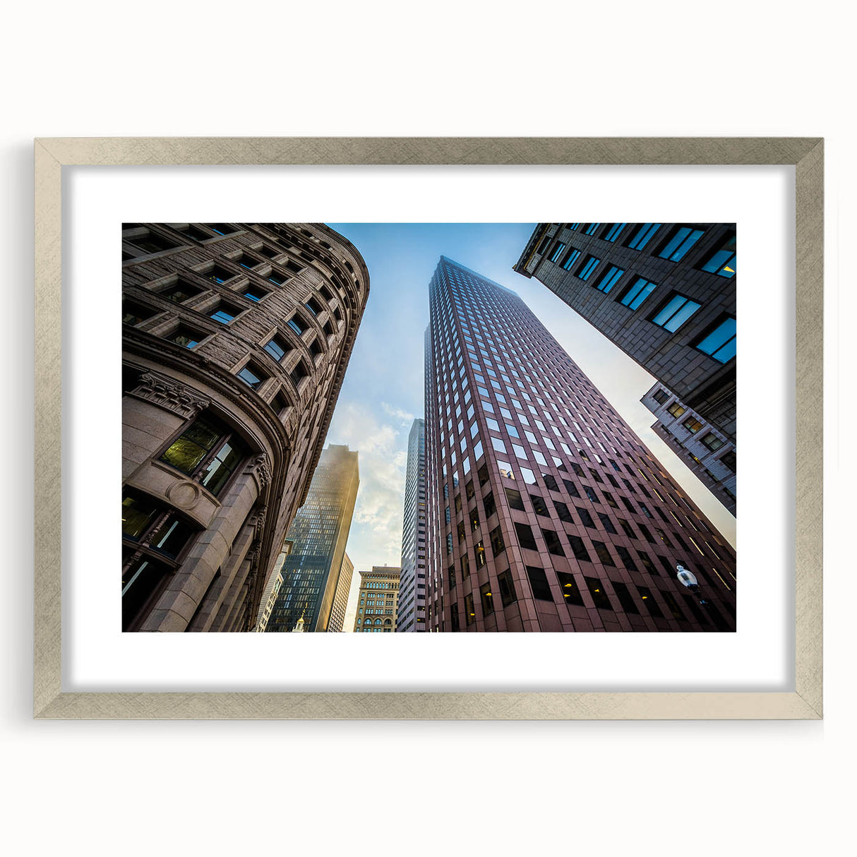 Textured abstract art print of Boston skyline in muted blue and gray tones on a silver-framed mat.