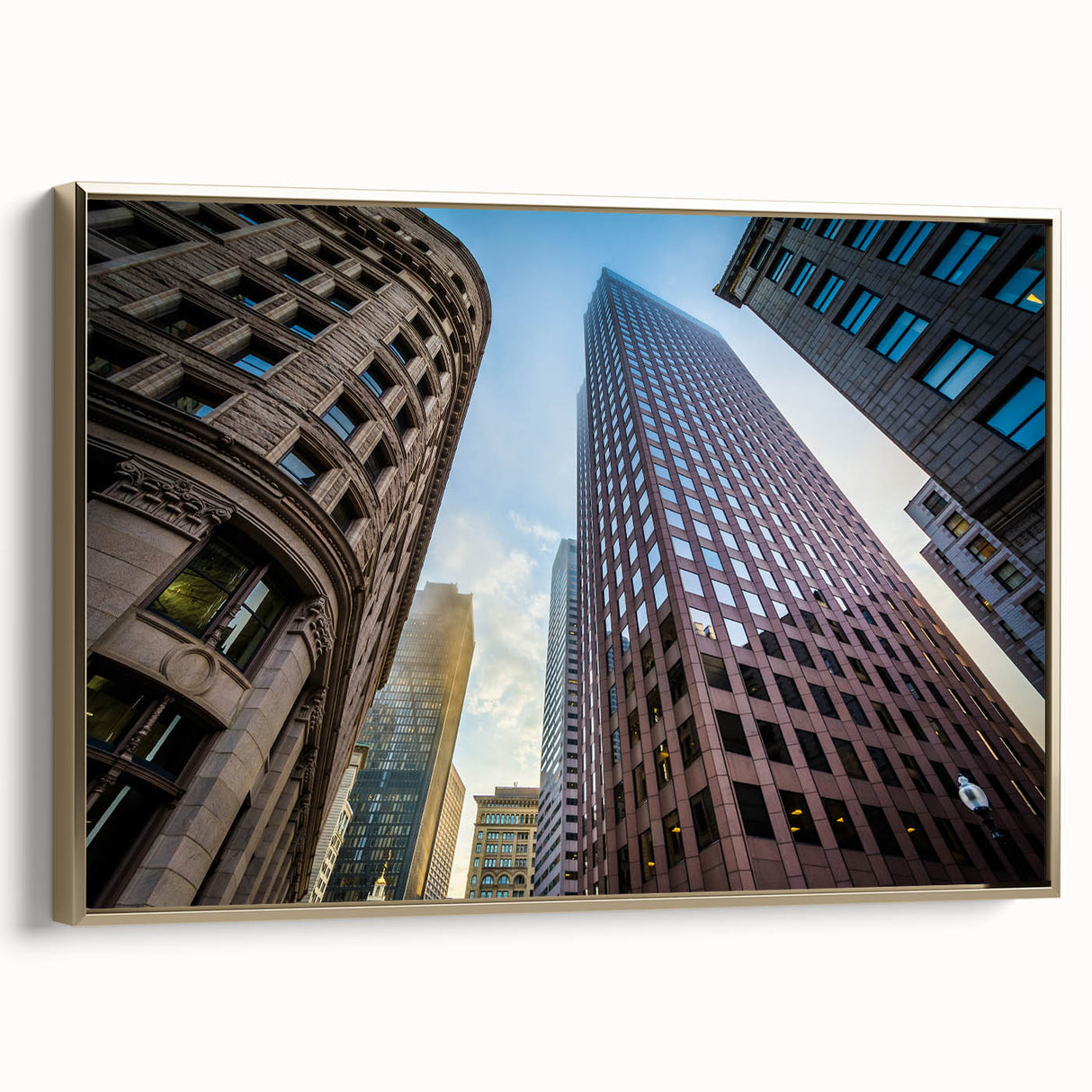 Framed canvas featuring a vintage-style landscape painting of the Boston skyline in black and gold tones.
