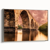 Framed canvas of a vintage-style Minneapolis landscape painting in muted gray and black with colorful accents.
