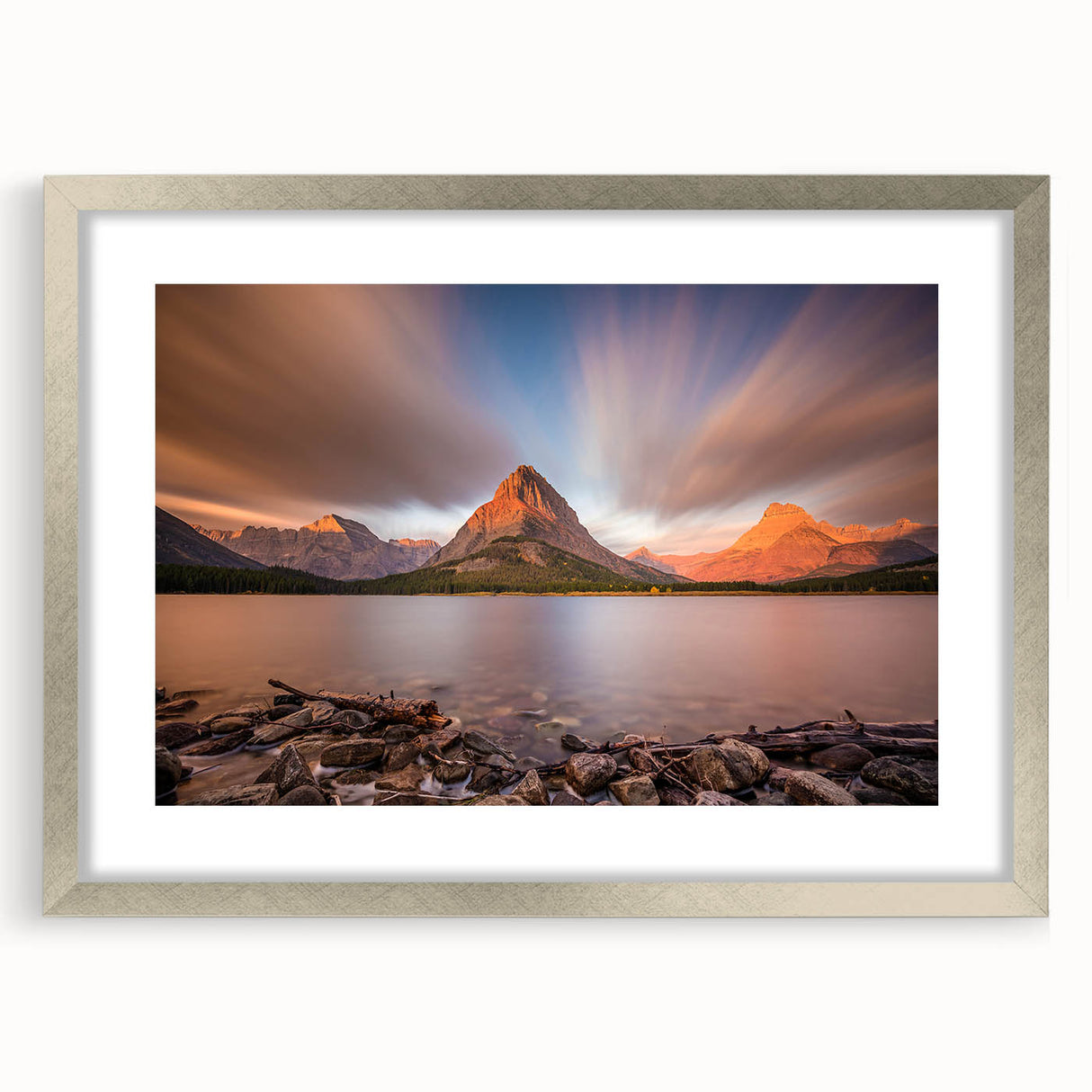 Textured art print of abstract Montana scenery in muted earth tones, framed in silver, ideal for bedroom wall decor.