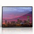 Large abstract wall art depicting Charlotte skyline in muted gray and blue tones on framed acrylic.