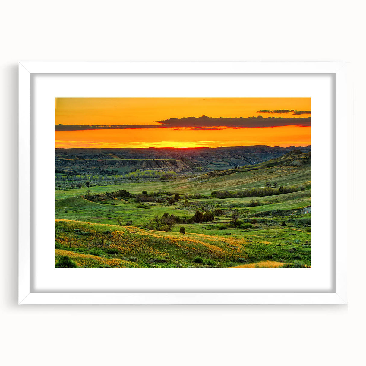 Abstract art print of North Dakota scenery in muted earth tones on a white framed mat, suitable for dining room decor.