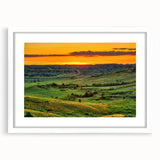 Abstract art print of North Dakota scenery in muted earth tones on a white framed mat, suitable for dining room decor.