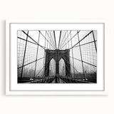 Abstract art print of the Brooklyn Bridge in muted gray tones on a framed white mat, ideal for bedroom or dining room decor.