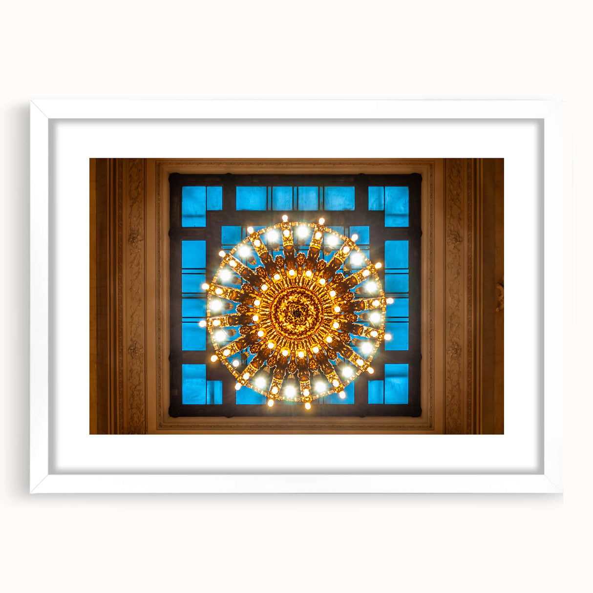 Abstract art print of NYC's Grand Central in muted gray and blue tones on a white-framed poster.