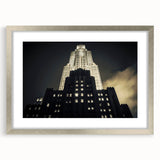 Textured art print of NYC skyline in muted gray tones on a framed silver mat, suitable for bedroom decor.
