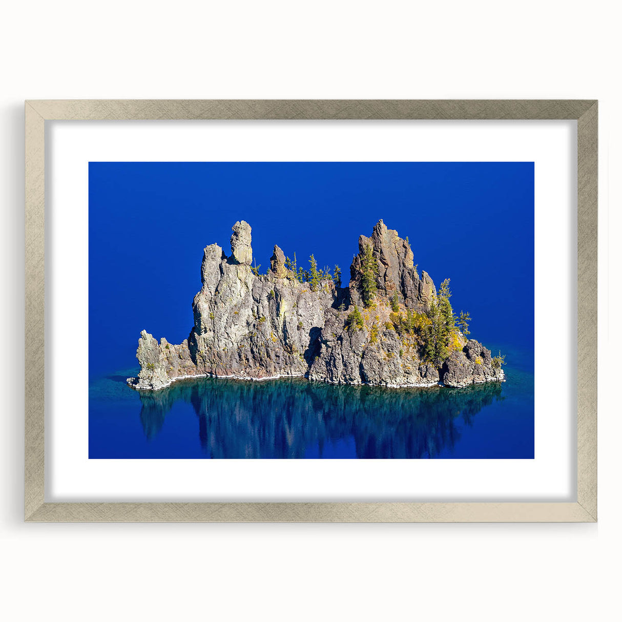 Textured art print of Crater Lake in muted blue and green tones, silver-framed with mat, suitable for bedroom art.