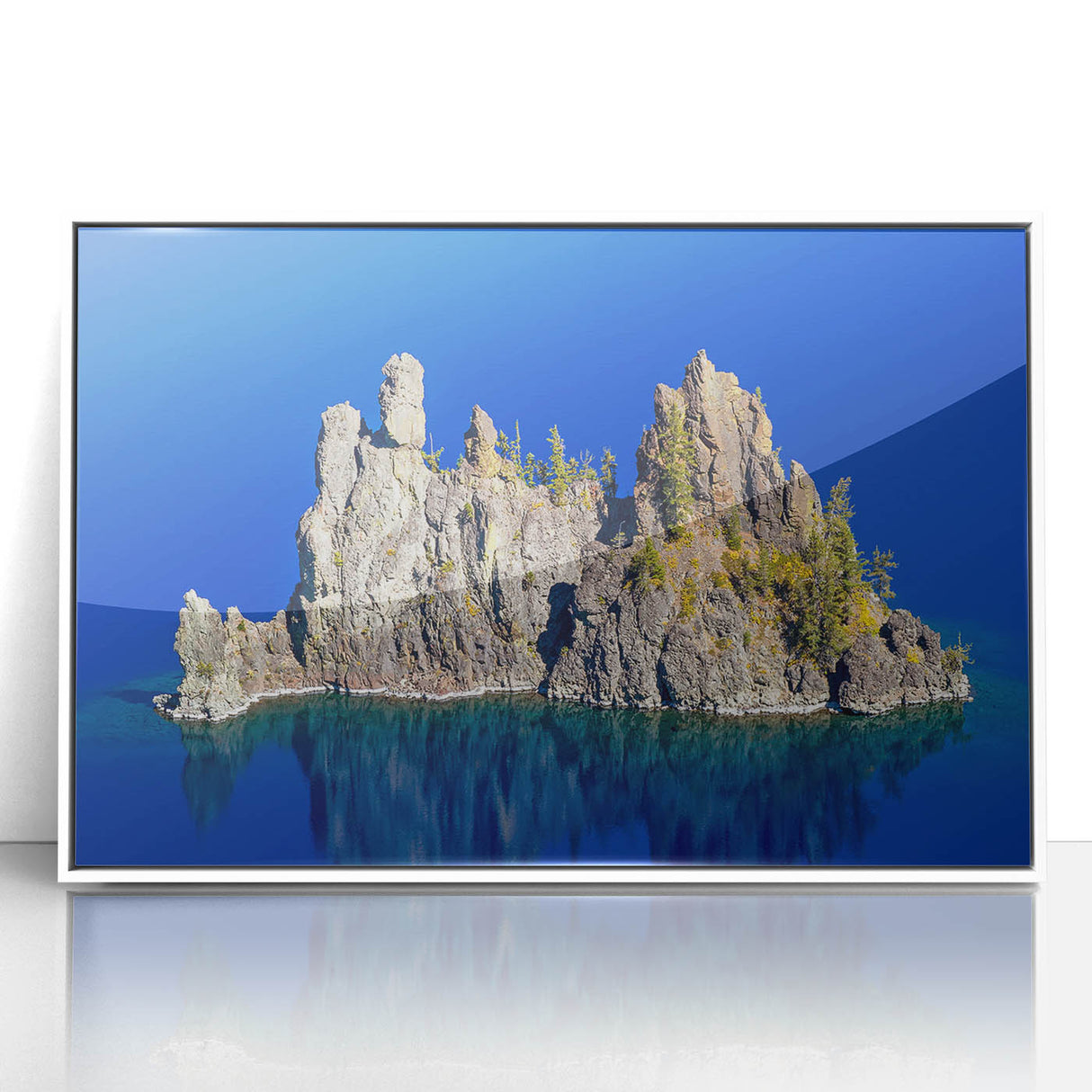 Acrylic print of Crater Lake in Oregon, framed in white, with vivid blue and green tones, ideal for modern art wall decor.
