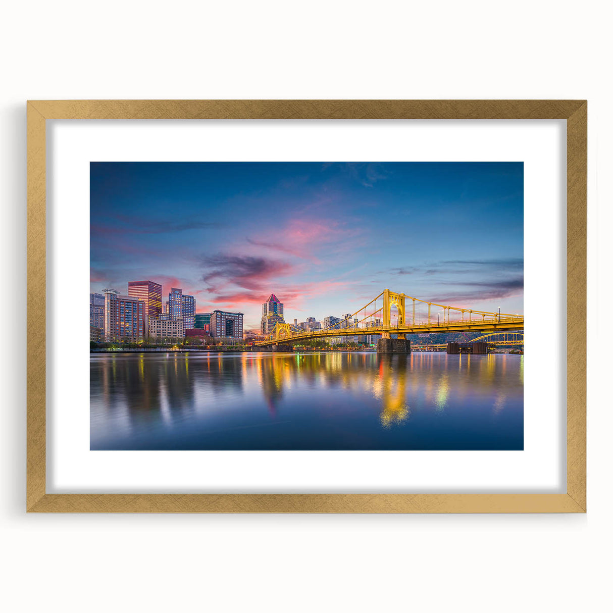 Extra large abstract art print of Pittsburgh skyline in gold frame, featuring textured brush strokes in muted earth tones.