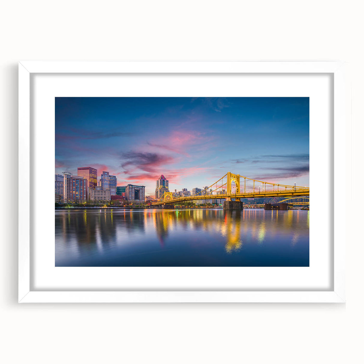 Abstract art print of Pittsburgh skyline in muted gray and blue tones on a framed white mat, suitable for dining room decor.