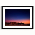 Extra large abstract art print of South Dakota Badlands in vibrant, colorful hues on a textured canvas, framed in black.