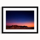 Extra large abstract art print of South Dakota Badlands in vibrant, colorful hues on a textured canvas, framed in black.