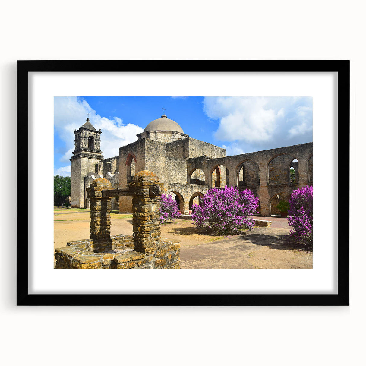 Colorful abstract art print of San Antonio skyline, featuring textured strokes in vibrant hues on a large framed canvas.
