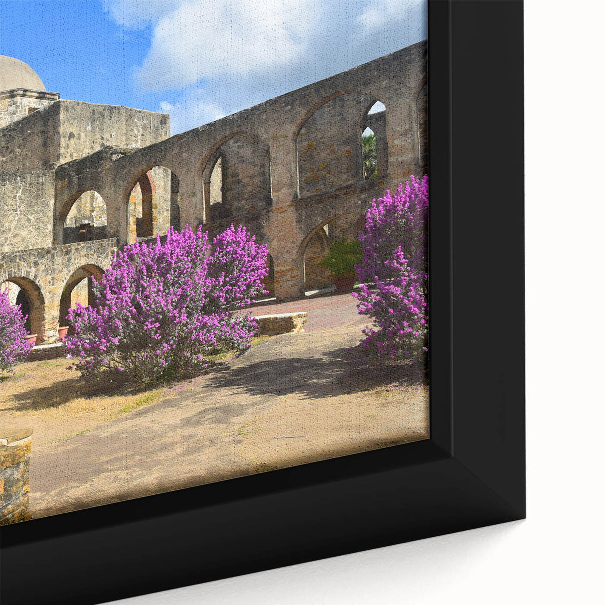 Black wall art featuring a textured depiction of the San Antonio skyline in vibrant colors on a framed canvas.