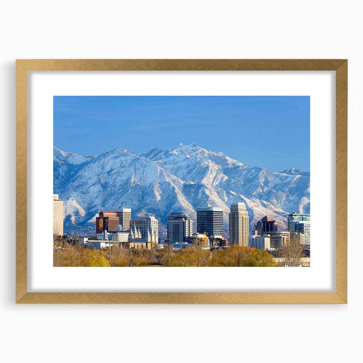 Extra large abstract art print of Salt Lake City, featuring textured swirls in earth tones on a gold-framed canvas.