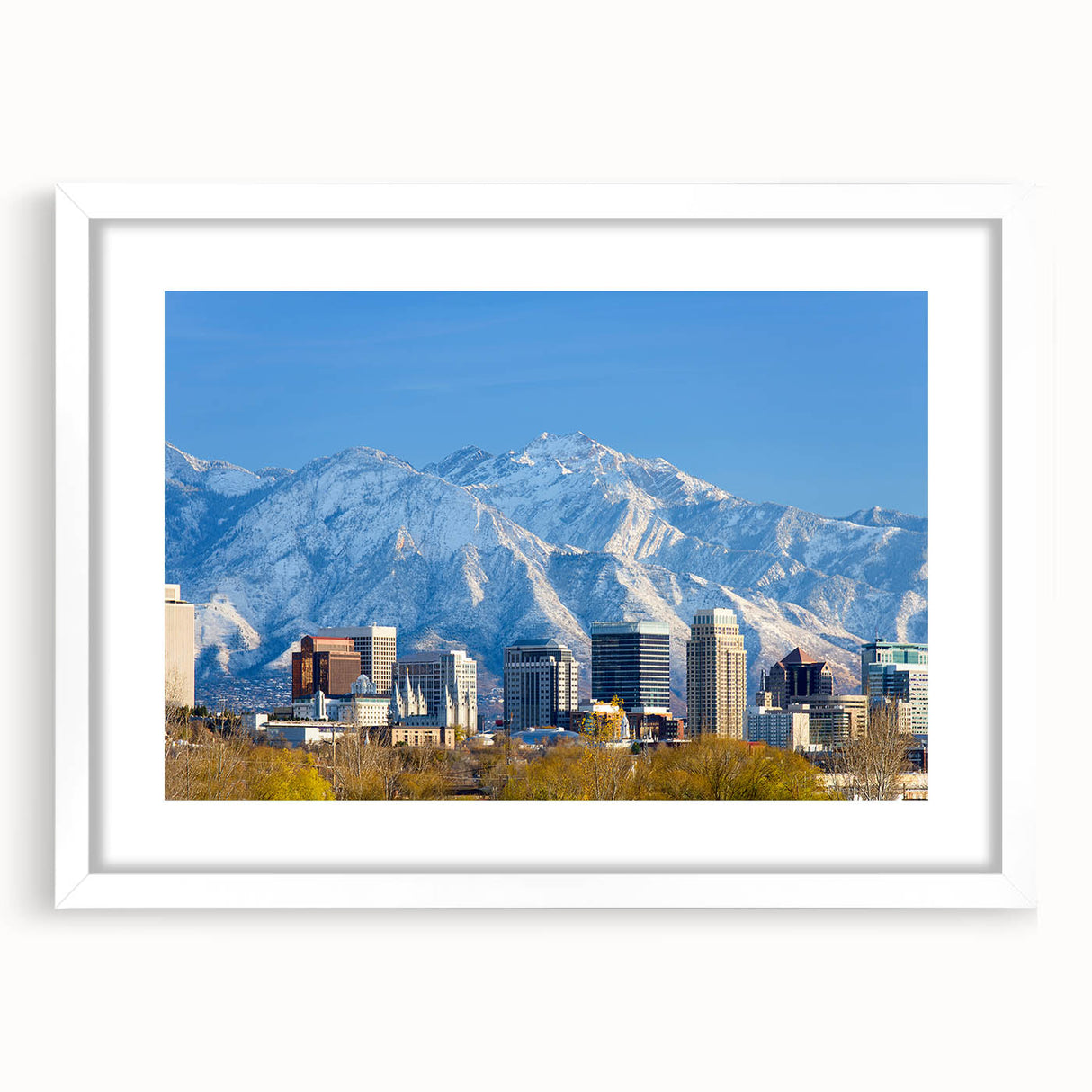 Abstract art print of Salt Lake City with muted earth tones on a white-framed canvas, suitable for dining room decor.