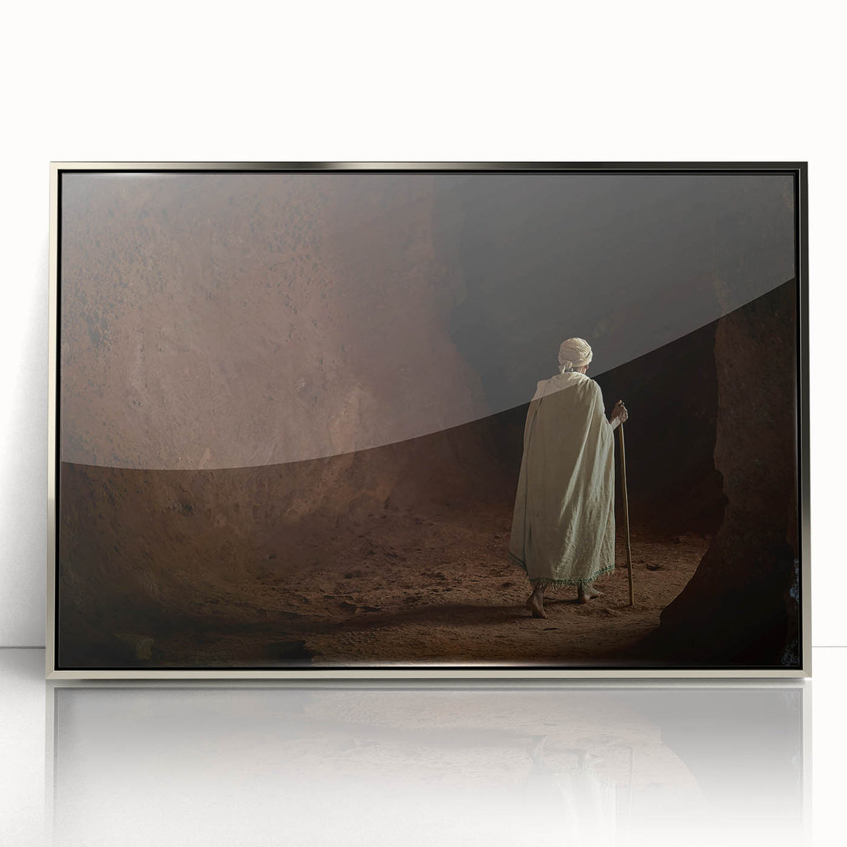 Acrylic print of an Ethiopian landscape in muted earth tones, framed in silver.