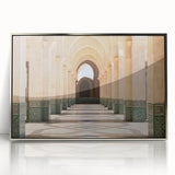 Art deco poster featuring a stylized Moroccan landscape in muted earth tones on a silver-framed acrylic print.