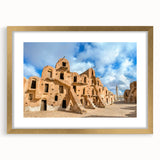 Extra large abstract art print depicting a textured African landscape in earth tones, framed in gold.