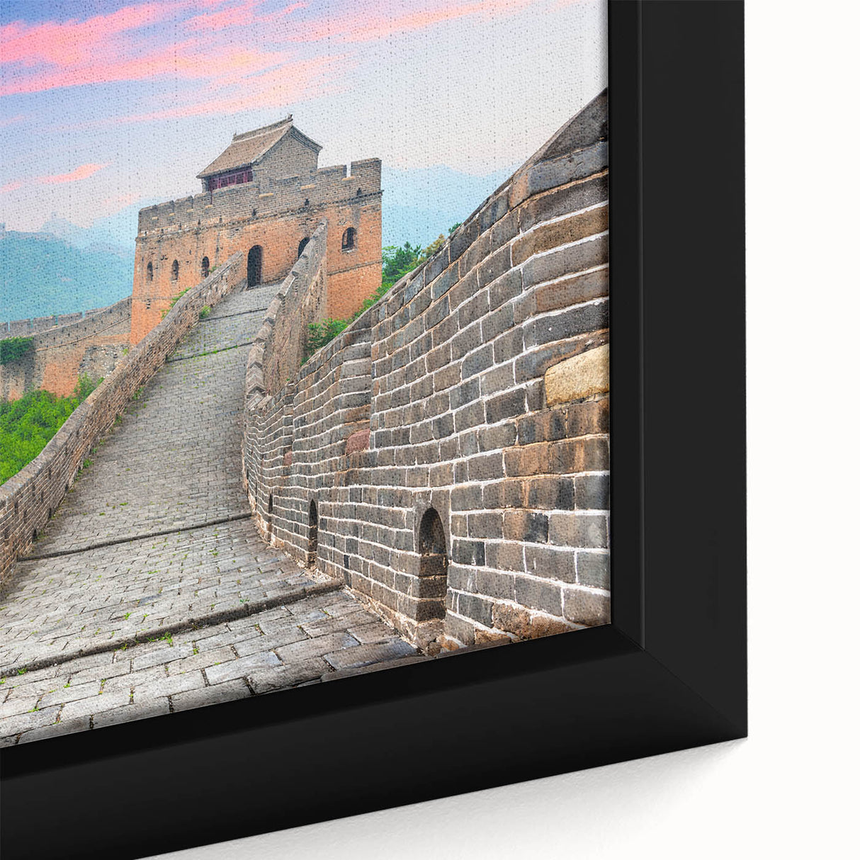 Close-up of a textured, black wall art depicting the Great Wall of China on a framed canvas, featuring colorful accents.