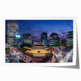 Rolled print of Seoul cityscape with soft pink cherry blossoms on a muted background, suitable for art wall dining room.