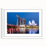 Abstract art print of Singapore skyline in muted gray and blue tones on a white framed canvas, ideal for dining room decor.