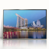 Mid-century modernist art of Singapore skyline in muted gray and blue tones on framed acrylic.